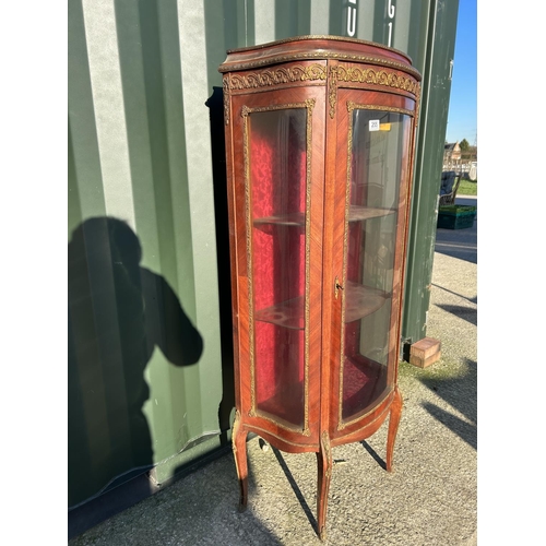 255 - A continental glazed single door cabinet with inlay and gold gilt mounts  70x37x150