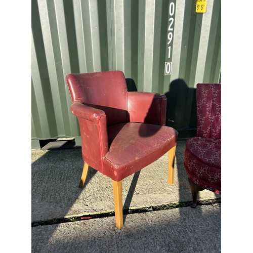 256 - A red leather office desk chair together with a red pattern bedroom chair