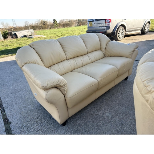 262 - A pair of cream leather sofas labelled LINEA (3 seater & 2 Seater )