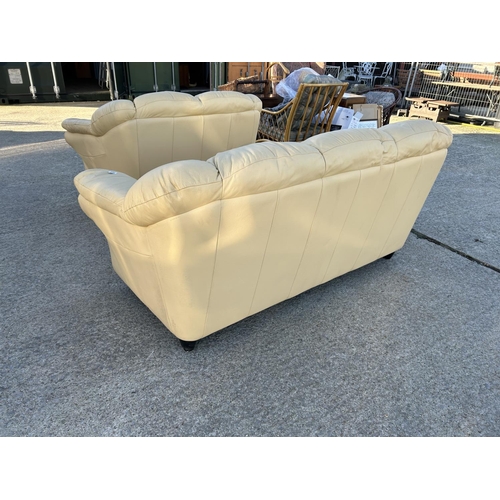 262 - A pair of cream leather sofas labelled LINEA (3 seater & 2 Seater )