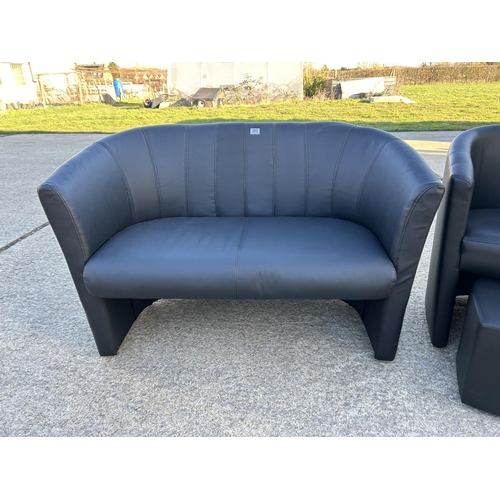 263 - A compact size modern black leather effect two seater sofa with macting armchair and stool