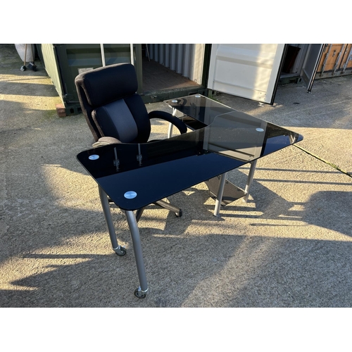 270 - A modern black glass swivel out workstation desk with desk chair