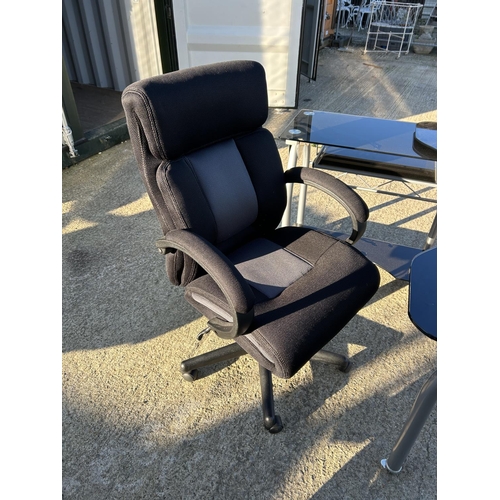 270 - A modern black glass swivel out workstation desk with desk chair