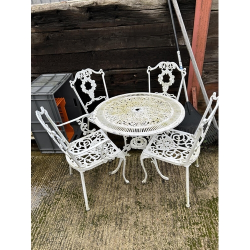 367 - An ornate white aluminium garden table with four matching chairs