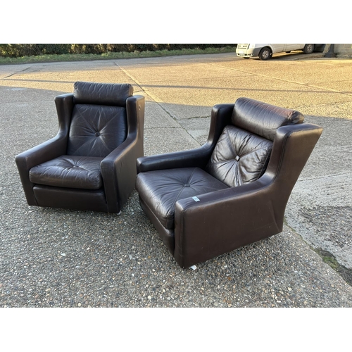 37 - A pair of Danish style leather armchairs