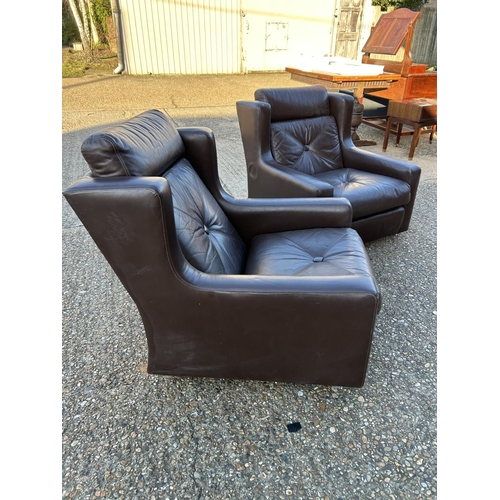 37 - A pair of Danish style leather armchairs