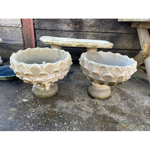 373 - A pair of ornate concrete pedestal urns