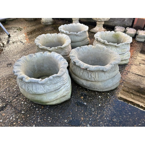 374 - A set of 5 sack effect concrete planters