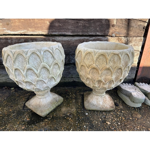 376 - A pair of pattern concrete urns