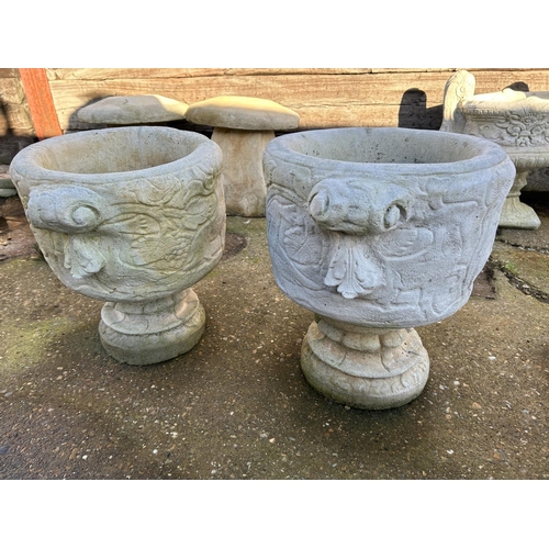 379 - A pair of decorative concrete urns