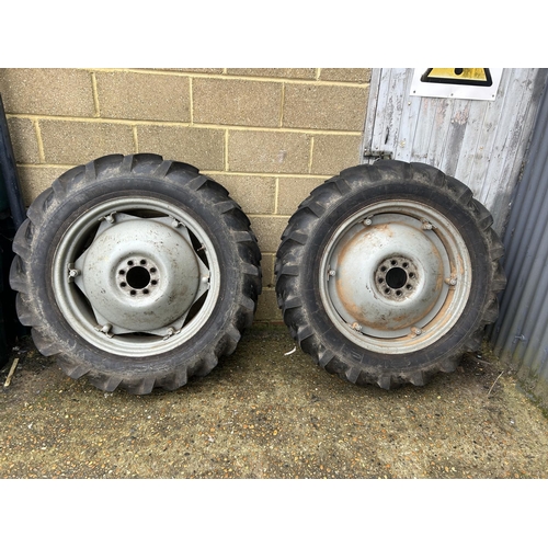 396 - A pair of rear wheels and VICTORIA rubber tyres to fit Ferguson tractor