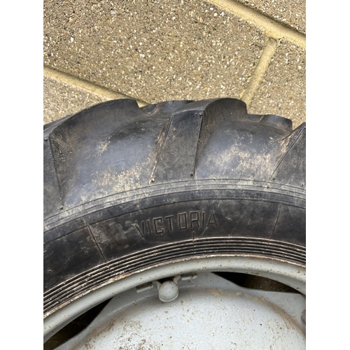 396 - A pair of rear wheels and VICTORIA rubber tyres to fit Ferguson tractor