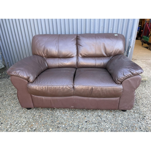 48 - A brown leather two seater sofa