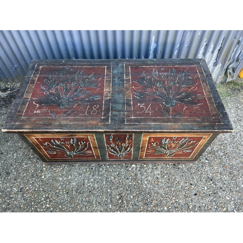56 - A Flemish style antique pine blanket box painted in red and green 133x67x60