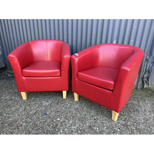 68 - A pair of modern red leather effect tub chairs