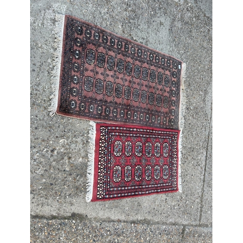 73 - 2 Oriental pattern rugs larger 85x130