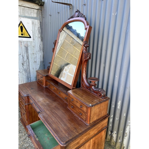 82 - A Victorian mahogany twin pedestal dressing table with swing mirror top over a 9 drawer pedestal bas... 