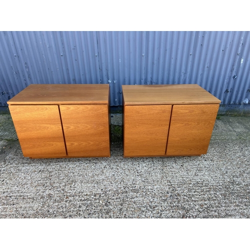 9 - A pair of mid century teak two door sideboard / cupboards by TAPLEY