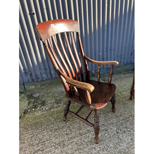 90 - A farmhouse style Windsor armchair together with an oak occasional table