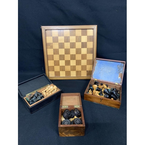 469 - Wooden games board, 2 boxes chess pieces and box draughts, all incomplete