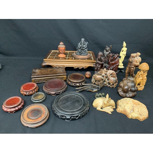 473 - Collection of carved figures and others and hardwood stands