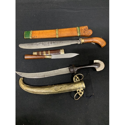 493 - 3 oriental knives and sheaths