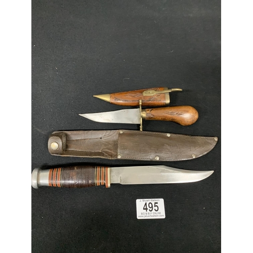 495 - Hunting knife marked J H Thompson in leather sheath, length 36cms and Indian Dagger in wooden sheath