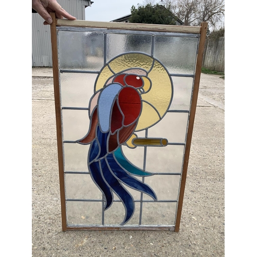 550 - Leaded stain glass panel depicting a parrot, 55 x 90cms overall