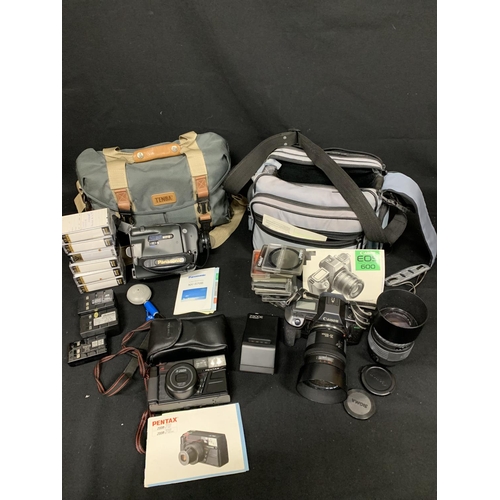 573 - Canon Eos 600 Camera and Lens, plus Sigma Lens, filters and bag, Panasonic Movie Camera and batterie... 