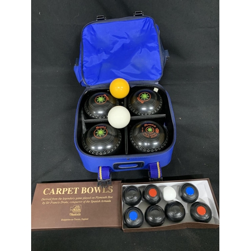 574 - Set of 4 bowling woods, size 5 medium and carry case and of carpet bowls