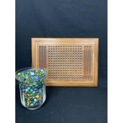 670 - Wooden Solitaire board and large jar of marbles (height 21 cms)