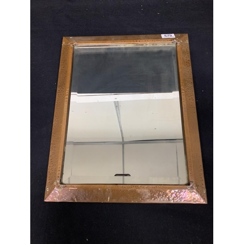 679 - Arts and Crafts beaten Copper framed bevelled mirror, 38 x 48 cms