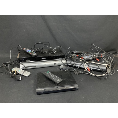 886 - Three DVD players with remotes, Sky box and leads