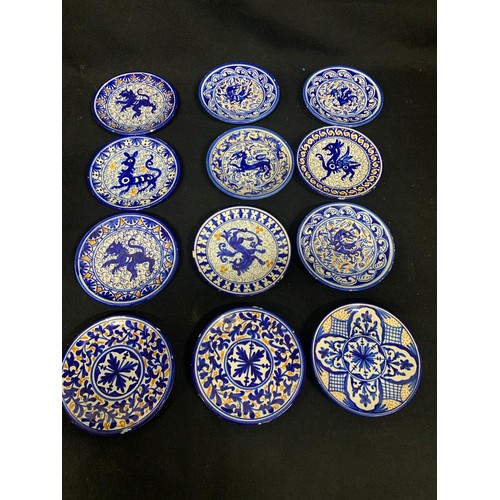 763 - 11 hand painted crackle glaze effect pottery plates diameter 20 cms, (one with chip) plus 12 other p... 