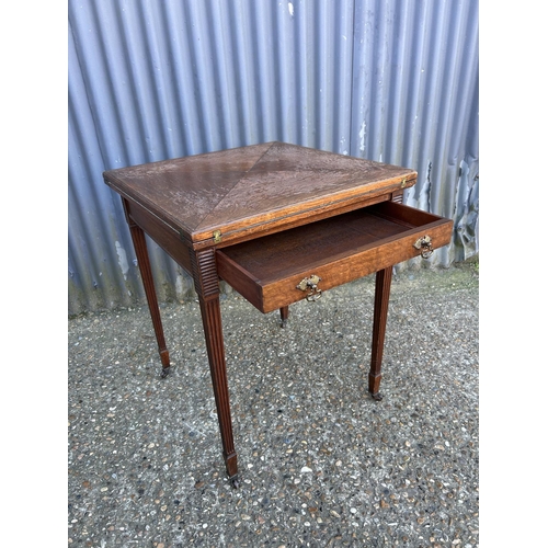 204 - An Edwardian oak envelope card table with drawer 60x60x74