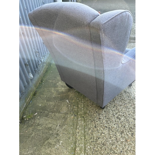 207 - A modern grey upholstered button back armchair