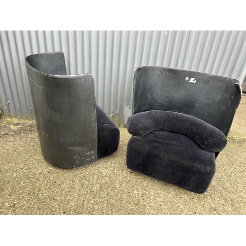 214 - A pair of modern leather and velvet tub shaped chairs