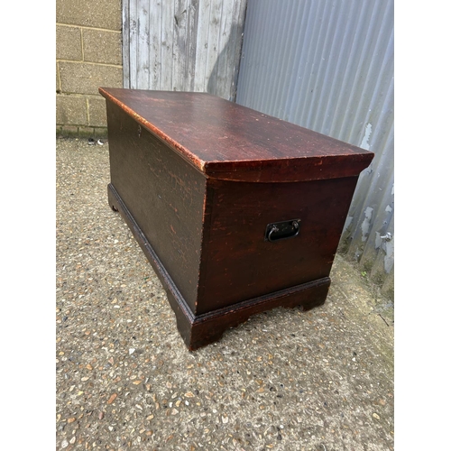 215 - A painted pine blanket box chest fitted with candle box and two drawers to the interior 108x55x58