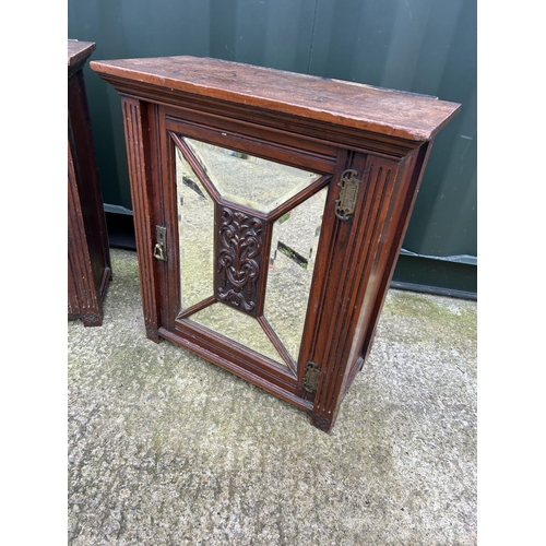 225 - A pair of Edwardian wall hanging cabinets with mirror doors