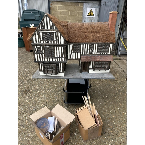 115 - A very large Tudor style dolls house with further bits  107x53x80