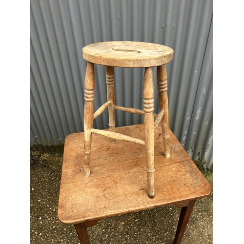 117 - An oak country table and a stool