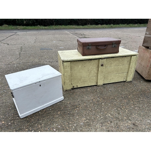 123 - A large yellow painted trunk, white box, case and two vintage packing cases