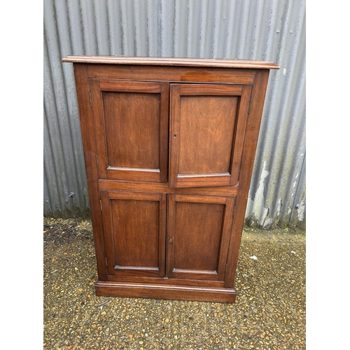 129 - A mahogany four door house keeping cupboard with lift up top  80x40x125