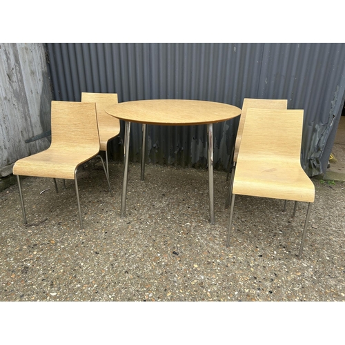 13 - An Italian designer circular table with four chairs by BILLIANI