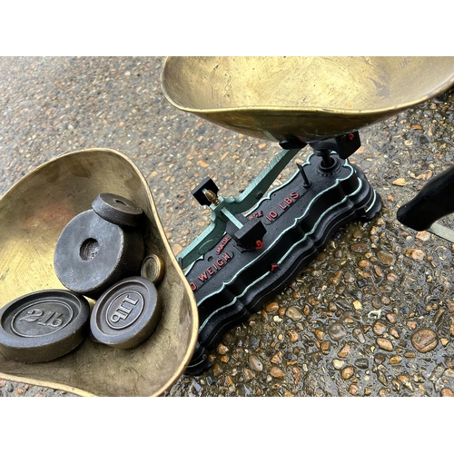 130 - Two vintage scales, a set of weights and three blow torches