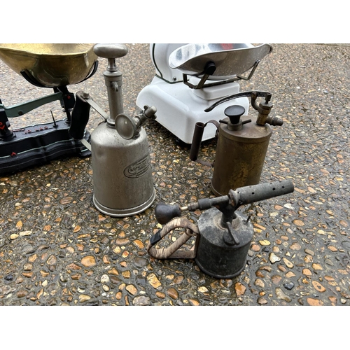 130 - Two vintage scales, a set of weights and three blow torches