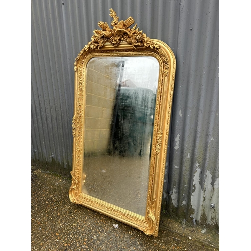 137 - A highly ornate gold gilt framed wall mirror with love birds decoration 80x 161