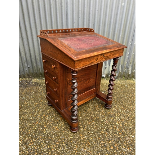 147 - A Victorian rosewood davenport desk with satinwood fitted interior, four drawers and four dummy draw... 
