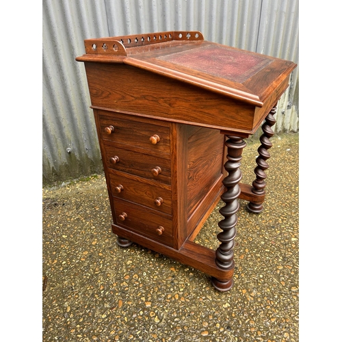 147 - A Victorian rosewood davenport desk with satinwood fitted interior, four drawers and four dummy draw... 