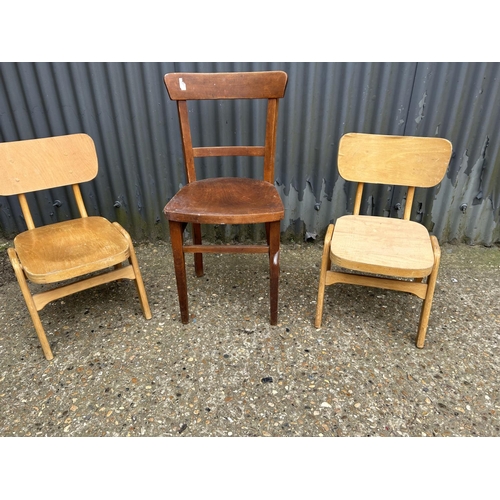 16 - A bent ply chair and a pair of vintage school chairs